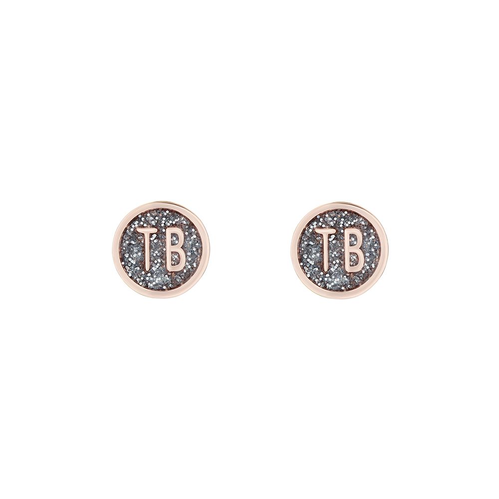 Ted Baker Dollsa Rose Gold Tone Stud Glitter Earrings TBJ2461-24-138 feature a rose gold border, black glitter enamel center, and "TB" initials in rose gold on each stud.