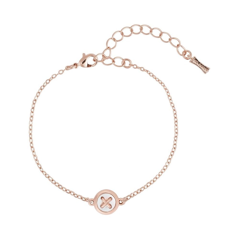The TED BAKER Brenna Mother Of Pearl Button Bracelet TBJ2226-24-46 features a rose gold design, adjustable clasp, and a circular charm accented with a cut-out cross—a refined addition to any jewelry collection.