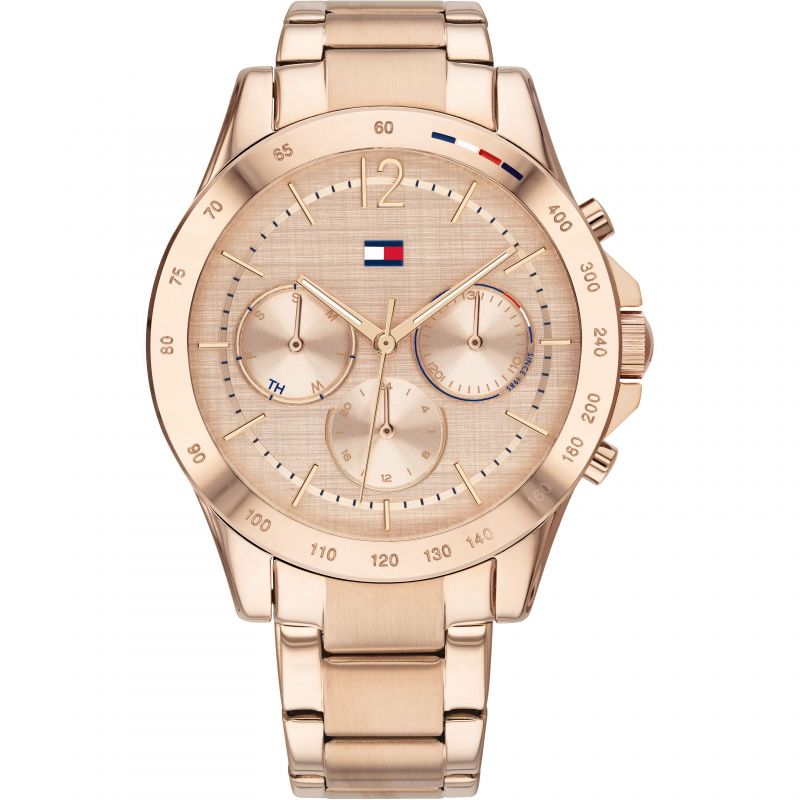 The Tommy Hilfiger 1782197 Women's Haven Bracelet Strap Watch in rose gold features an analog display with three subdials, a date indicator, and the Tommy Hilfiger logo on the face and bezel.