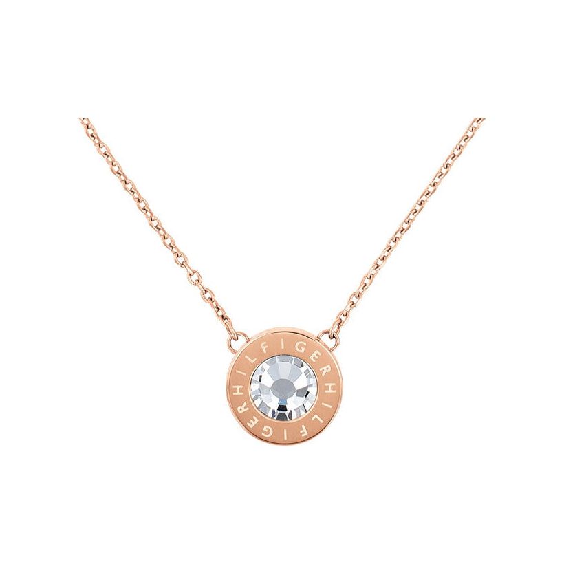 The TOMMY HILFIGER Ladies Rose Gold Tone Stainless Steel Crystal Necklace 2780285 features a round crystal pendant with a clear center gemstone and "HILFIGER" engraved around the edge.