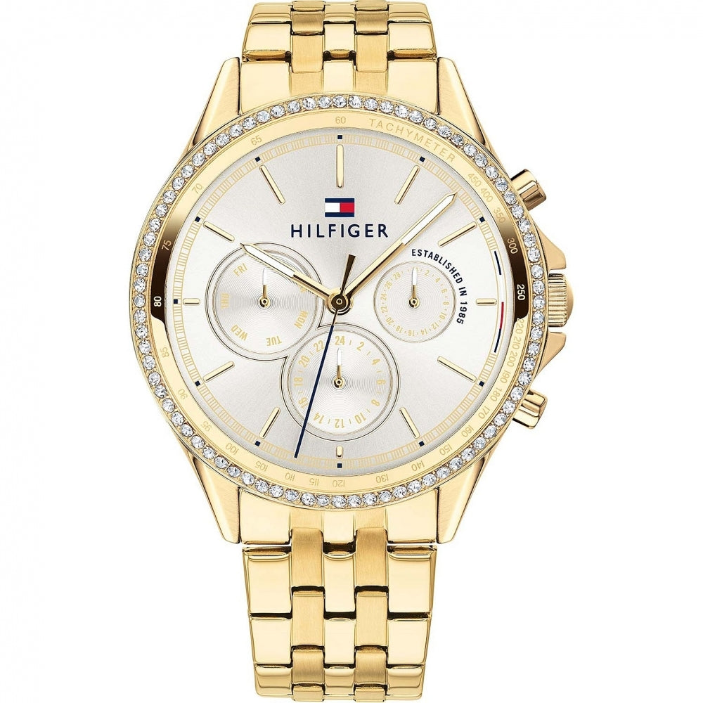 Tommy Hilfiger 1781977 Ladies Ari gold-tone bracelet watch featuring a crystal-set bezel, white dial with three subdials, quartz movement, and brand logo on the face.