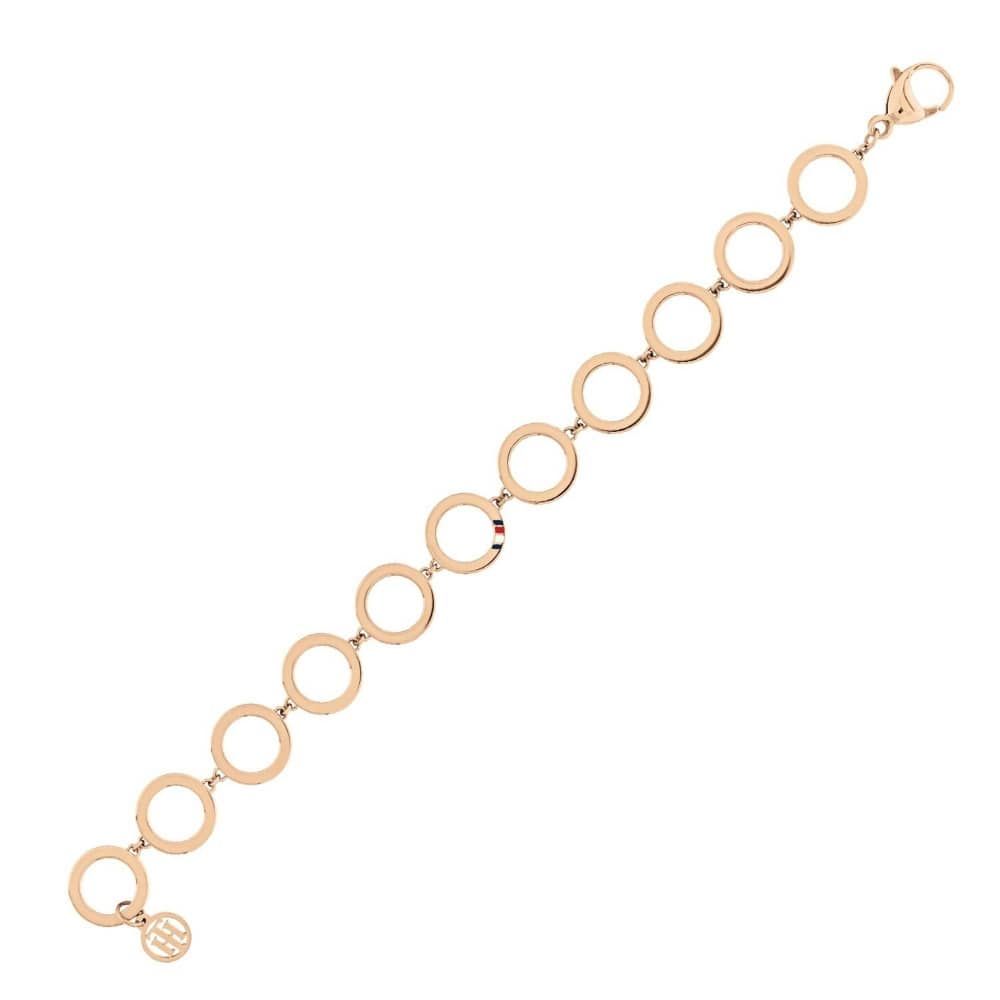 The Tommy Hilfiger Stainless Steel Rose Gold Tone Open Circle Bracelet 2780313 features large interconnected circular links and a small round charm, shown elegantly against a white background.